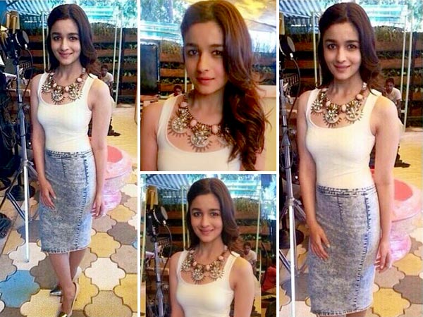 Alia wearing River Island skirt, Zara top and Outhouse statement necklace.