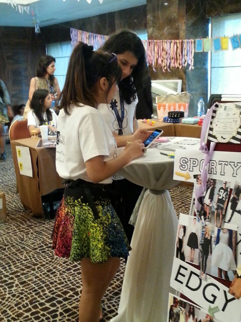People clustered around the StyleFix area, eager to get their style analysis based on their personalities!