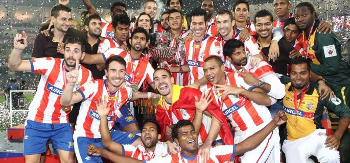 Mumbai: Atletico de Kolkata players celebrates after defeating Kerala Blasters FC to clinch the first ISL trophy at at D.Y Patil Stadium, in Mumbai on Dec 20, 2014. (Photo: IANS)